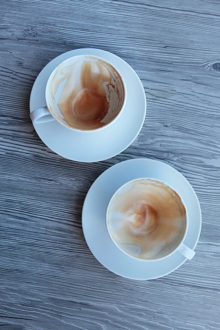 Two empty cappuccino cups