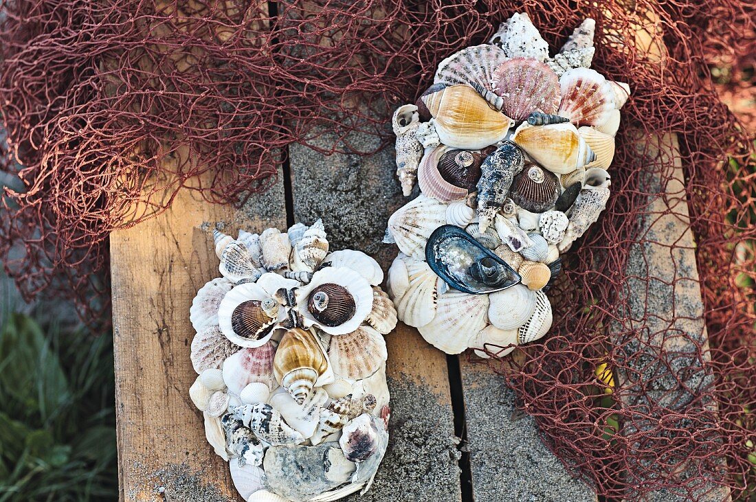 Maritime ornamental faces made from shells