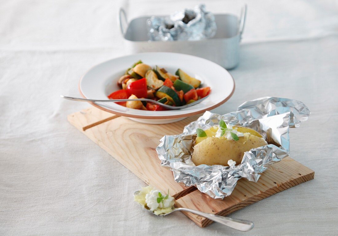 A baked potato with vegetable ragout