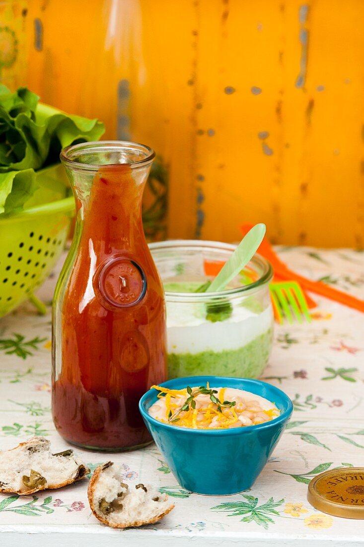 Tomato ketchup with chilli, a lemon and bean paste, and pea and mint yoghurt