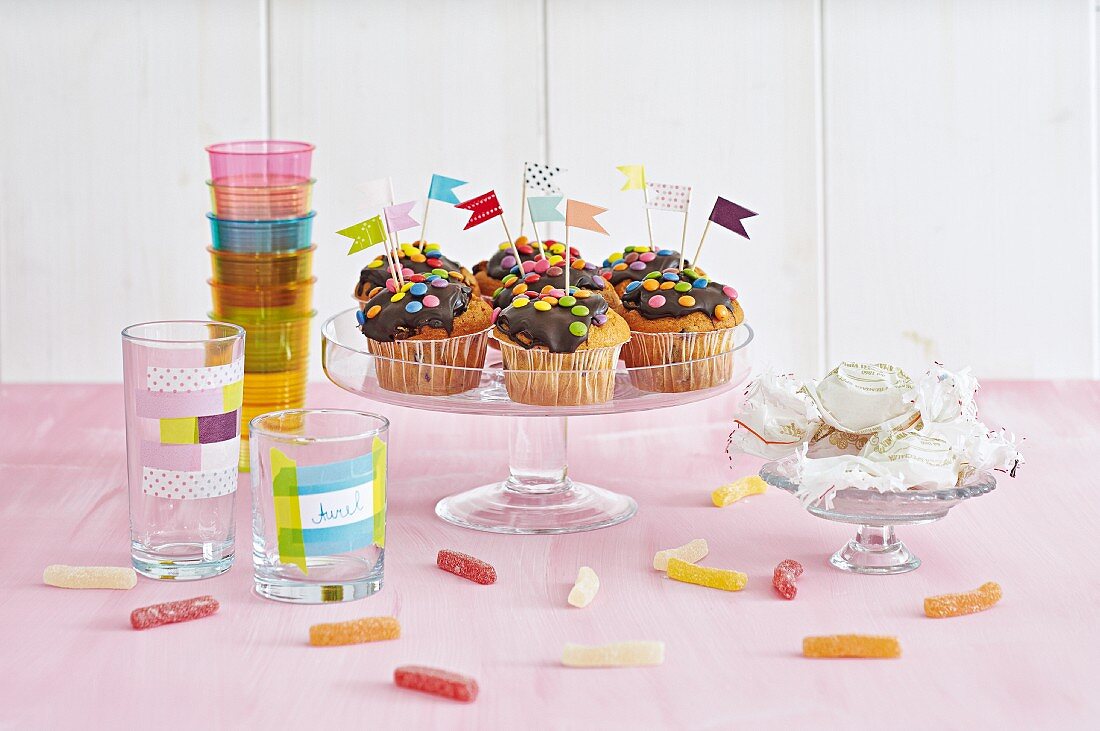 Muffins decorated for party with flag made from toothpicks and washi tape flags