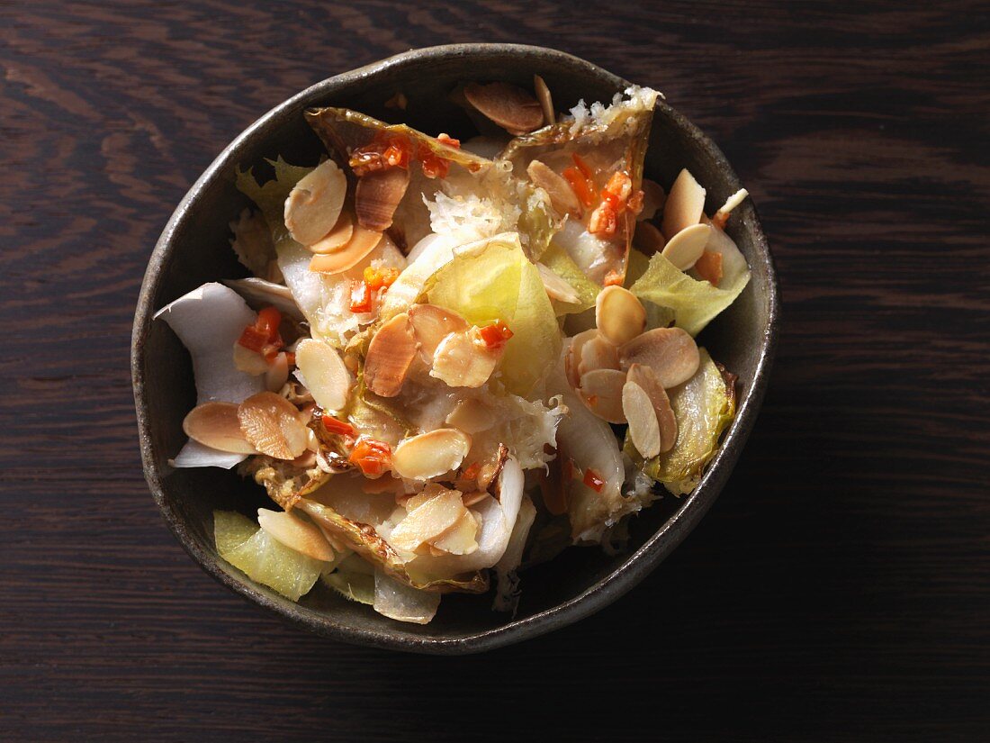 Oven-baked chicory with chilli butter and roasted, flaked almonds