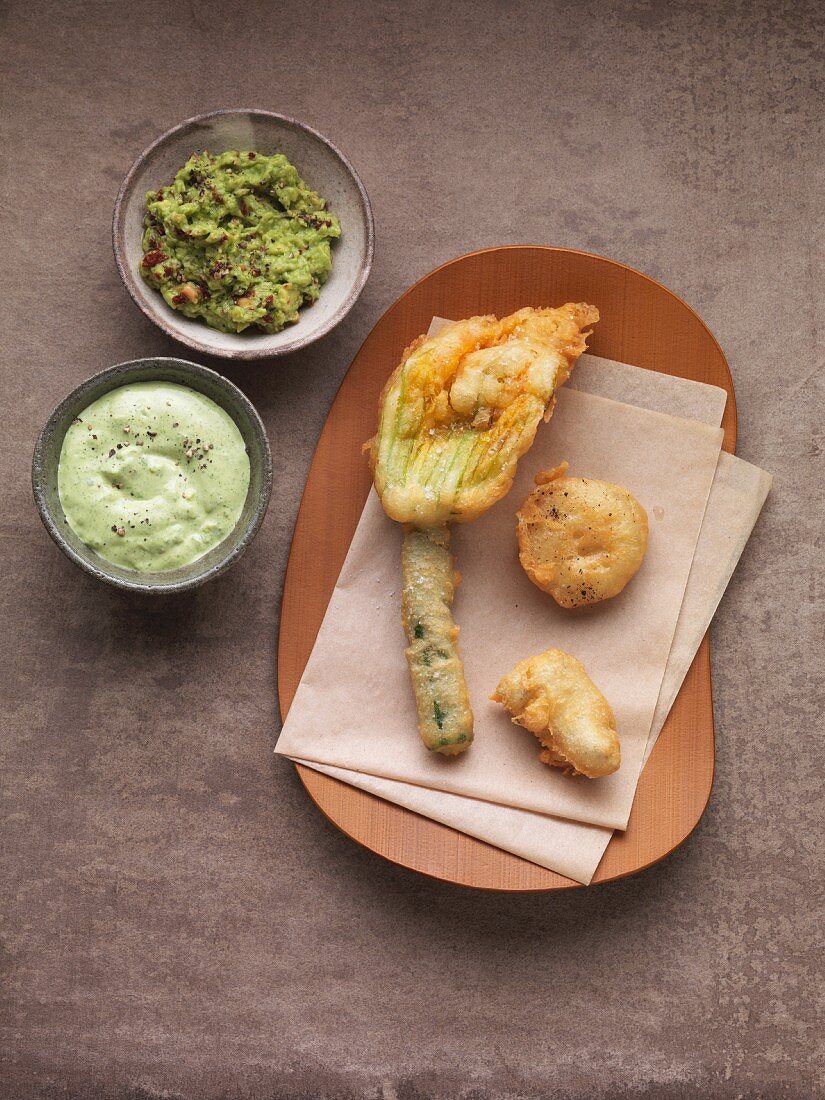 Vegetable tempura with an avocado dip and green sauce