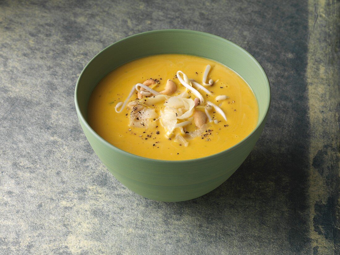 Vegan cream of pumpkin soup with bean sprouts and oriental spices