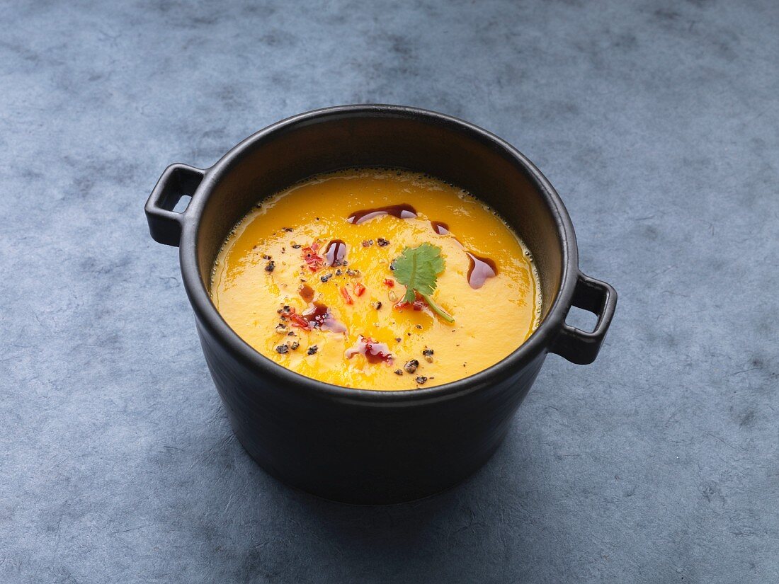 Vegan sweet potato soup with chilli and pumpkin seed oil