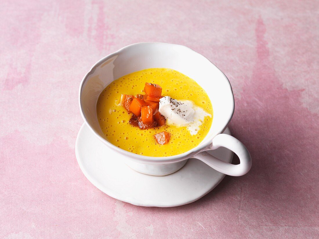 Sweet pumpkin soup with whipped cream