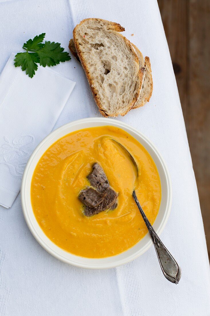 Sweet potato soup with beef strips (seen from above)