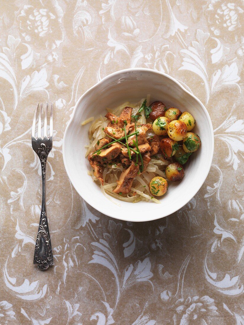 Braised hedgehog mushrooms with Bayerisch Kraut (Bavarian white cabbage salad) and potato balls