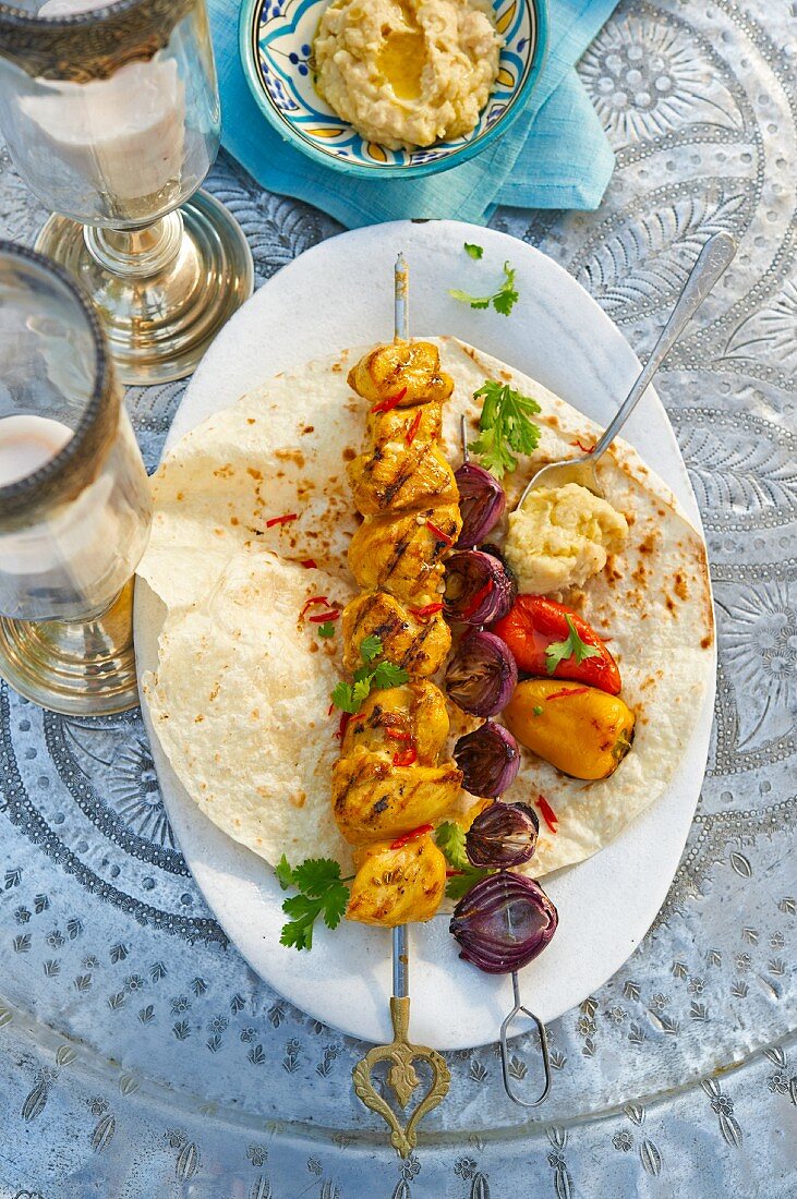 A grilled, oriental chicken skewer with onions and bean paste