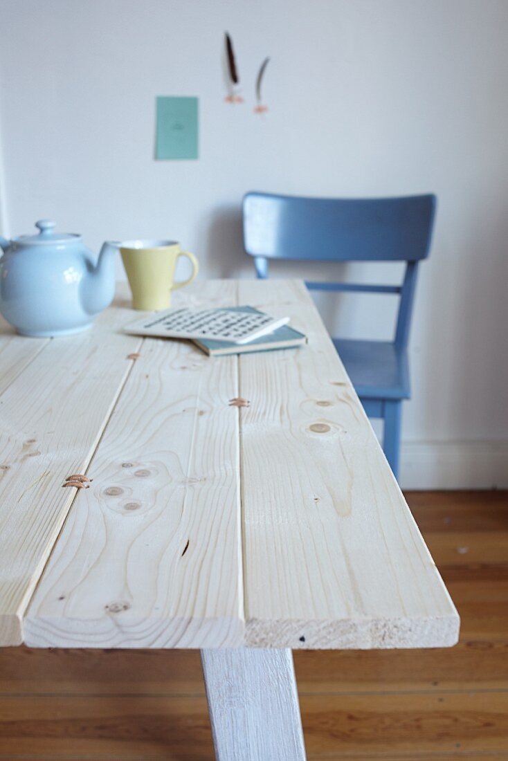 Tabletop made from pine boards joined by leather straps