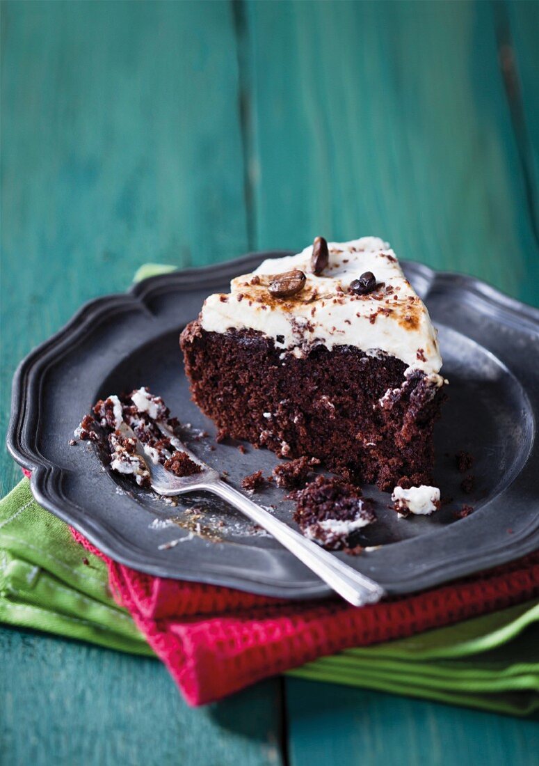 Cappuccino brownie cake with cream and coffee beans
