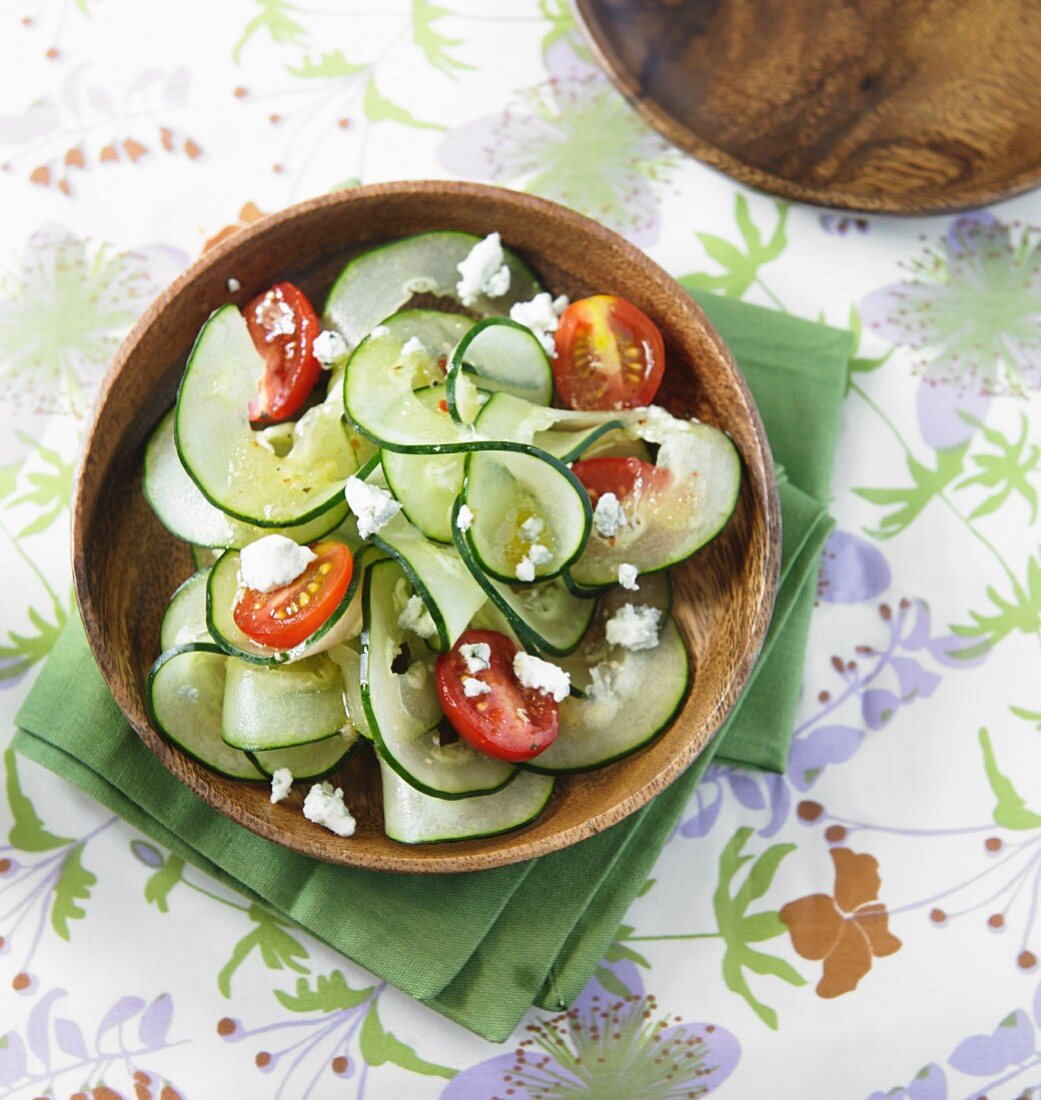 Spiral-cut cucumber with tomatoes and Gorgonzola cheese