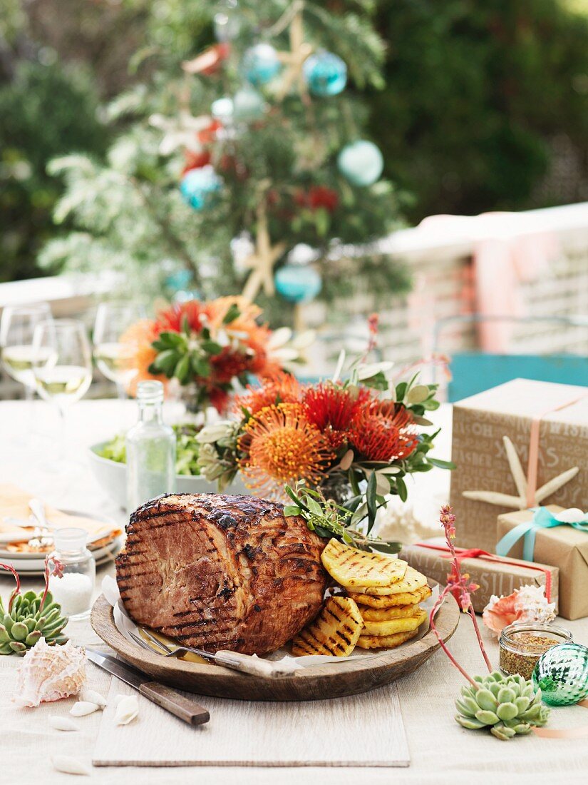 Roast ham on a garden table for Christmas