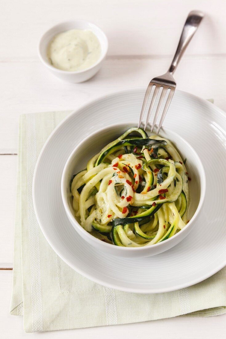 Vegetable spaghetti made from courgette with avocado sauce