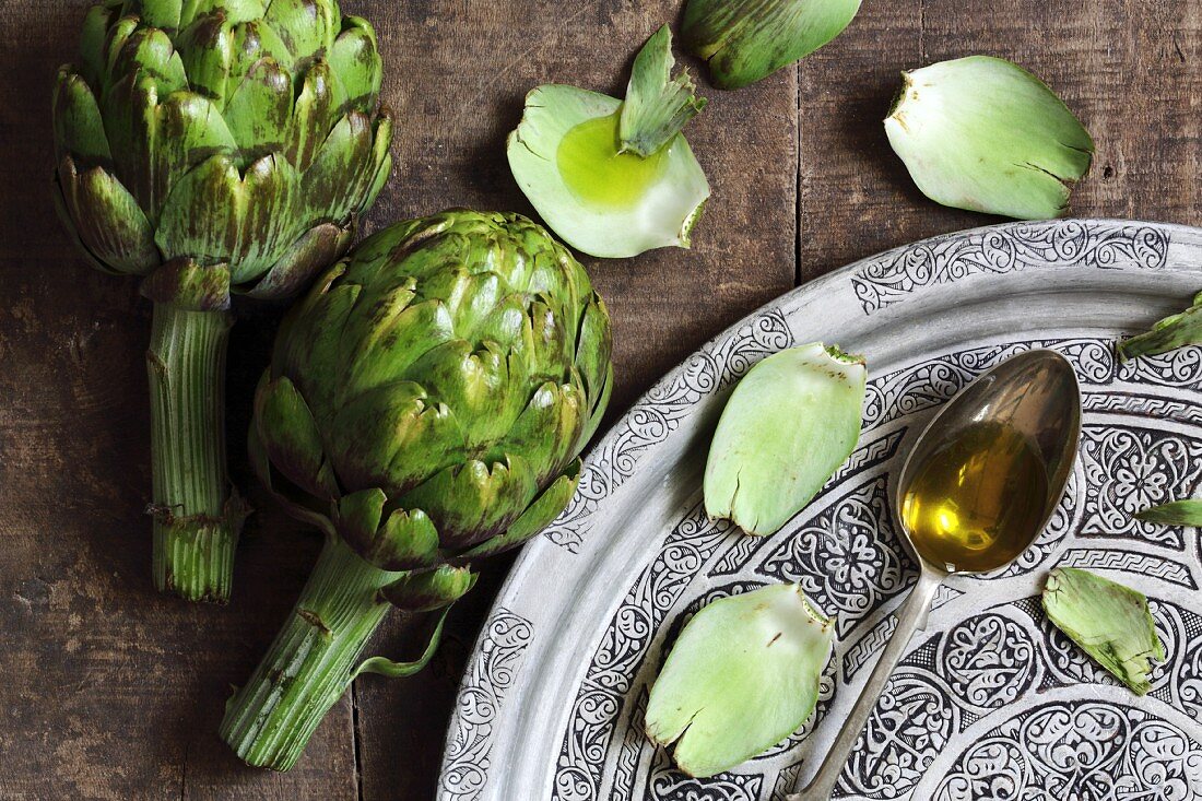 Artichokes and olive oil on a spoon