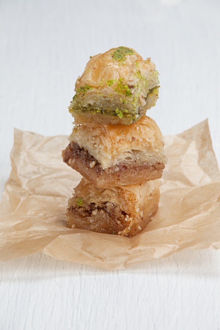 A stack of baklava on parchment paper