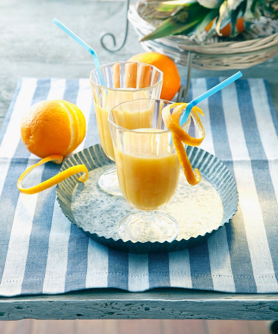 Oranges cocktails with pineapple and rum