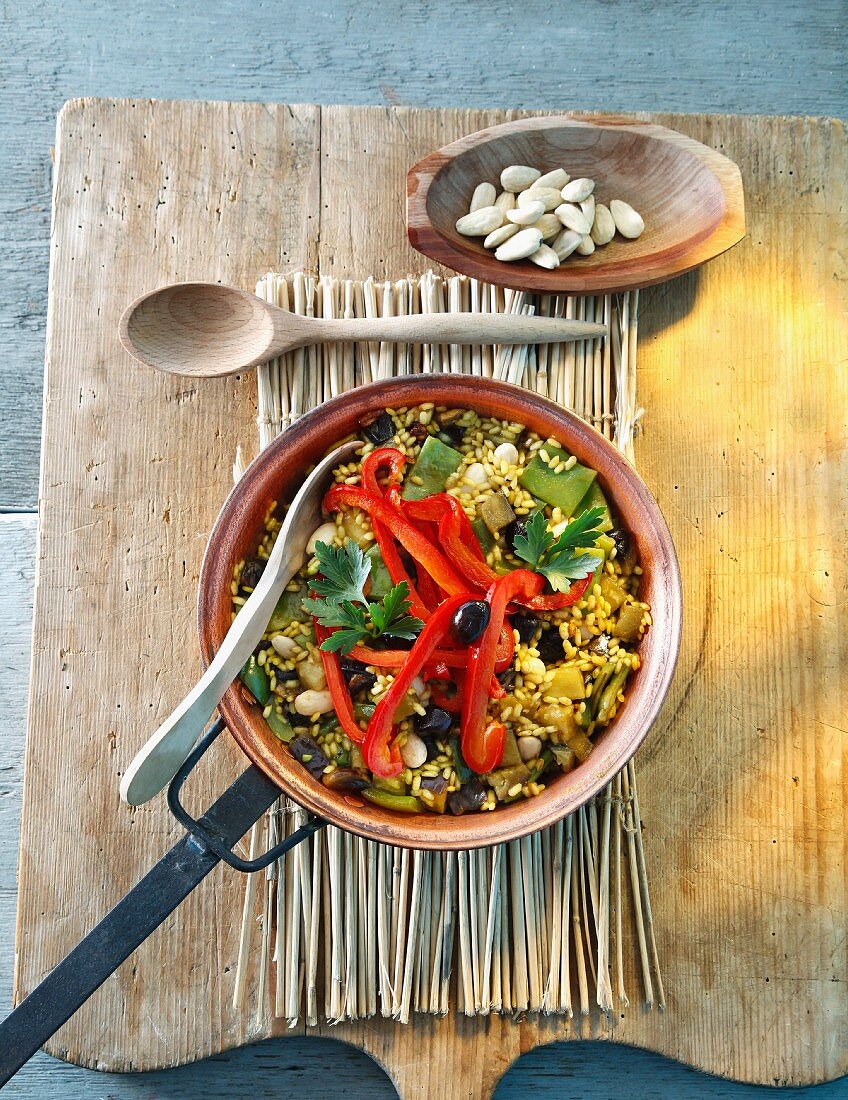 Vegetable paella with peppers and olives