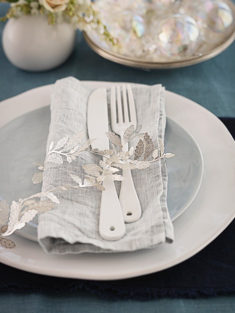 A place setting on a Christmas dining table