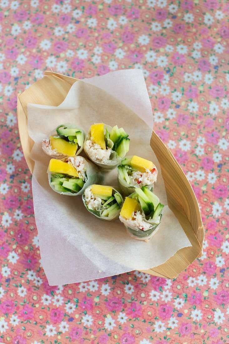 Vietnamese spring rolls filled with mango and crab