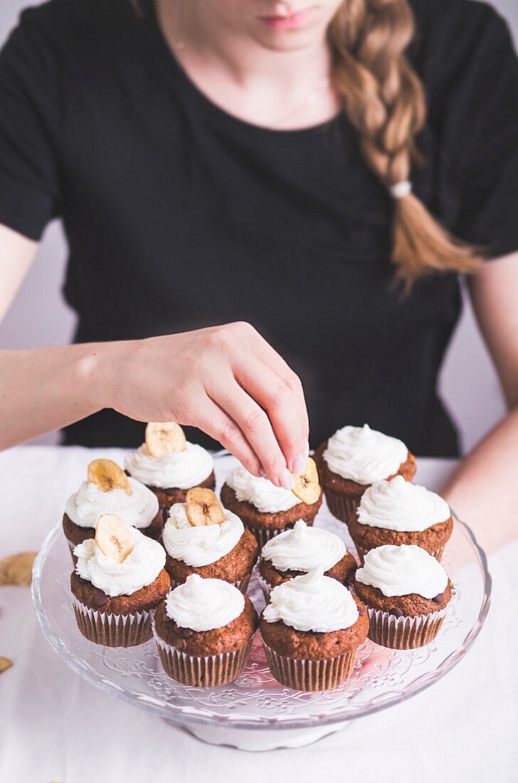 Cupcakes with banana frosting and banana chips