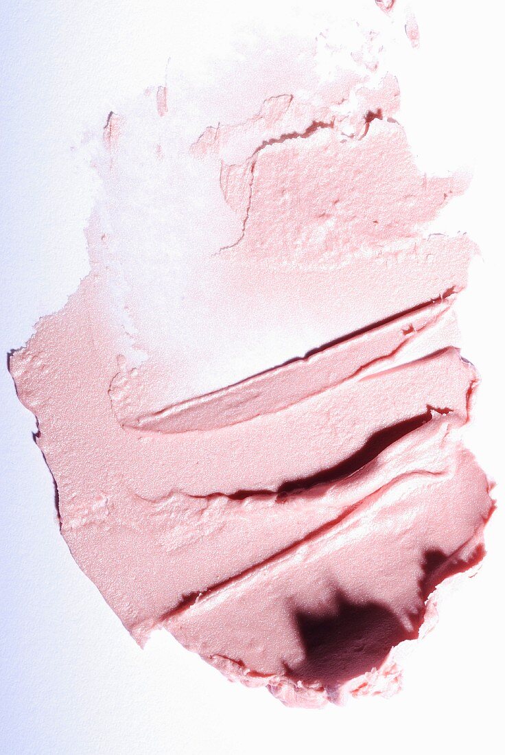 Light-pink lipstick on a white surface