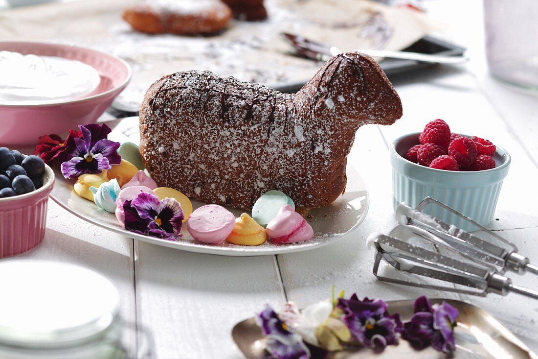 A baked Easter lamb with meringue dots on a serving platter