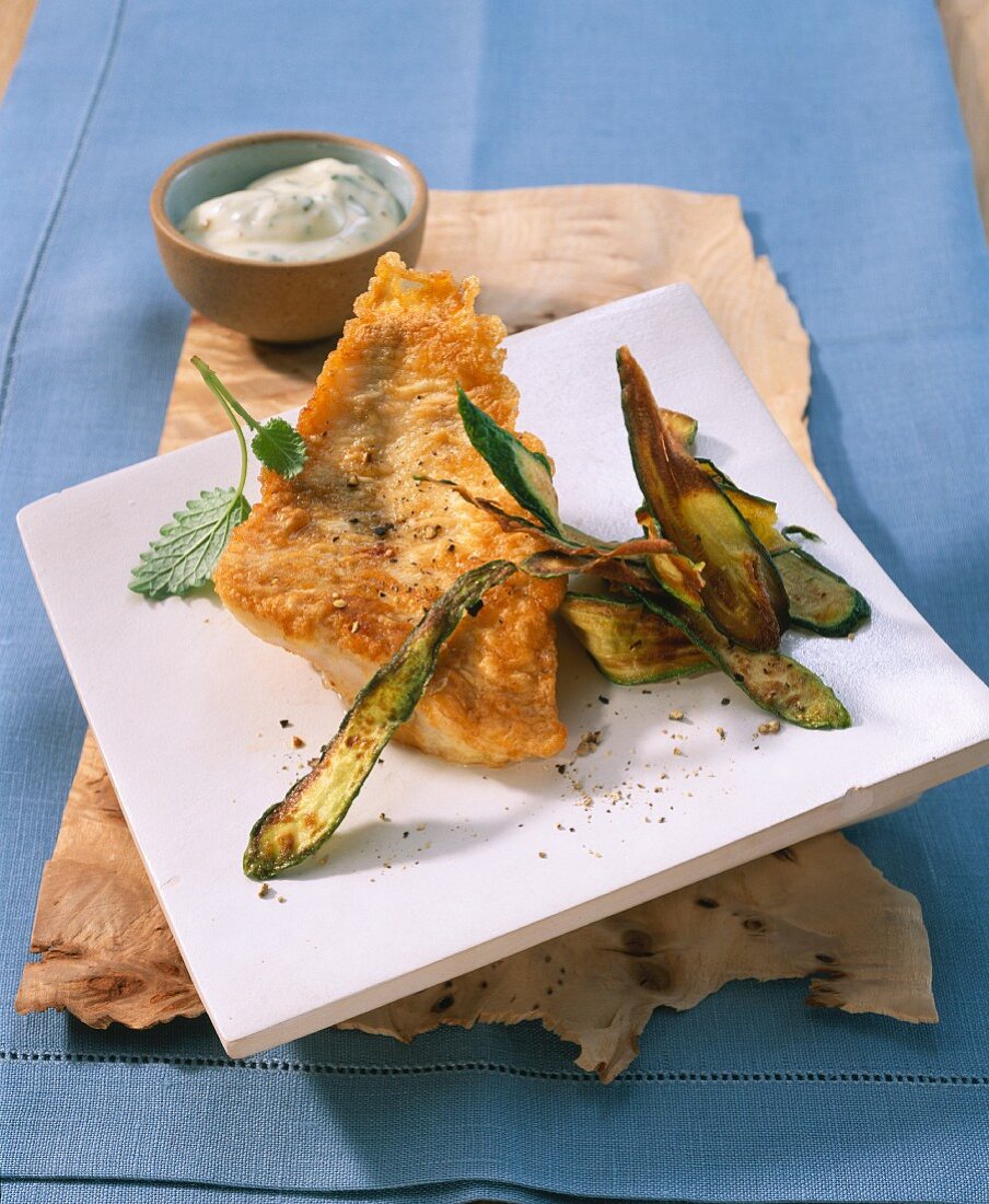 Perch fillet in an egg coating with fried courgette and herb mayonnaise