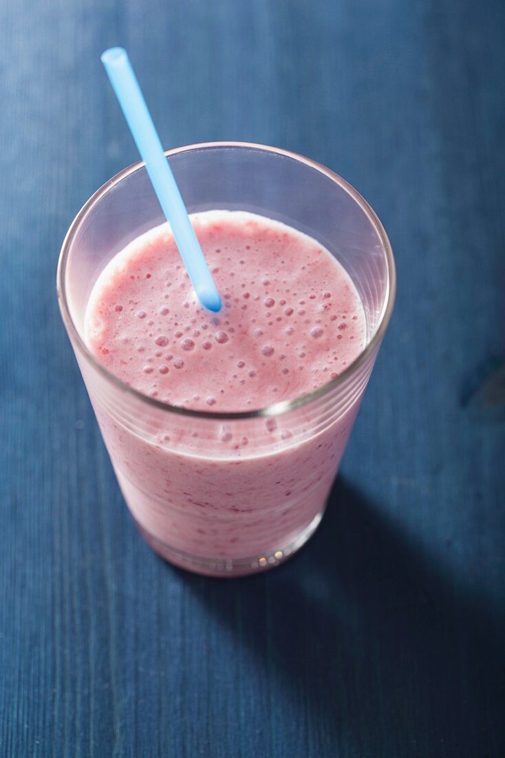 A vegan strawberry smoothie made with soy milk