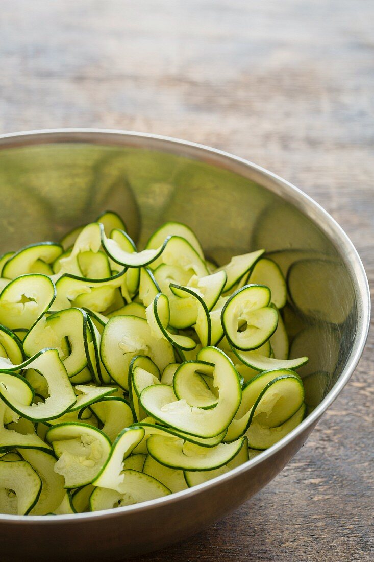 Courgette tagliatelle in a stainless steel bowl