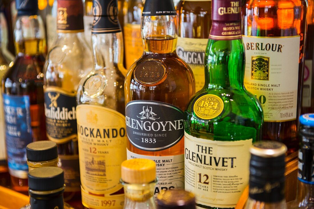 Various bottles of whiskey in a bar