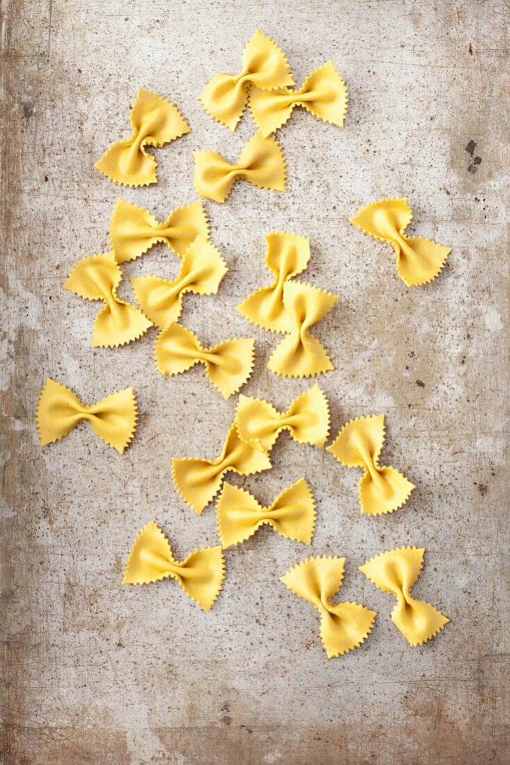 Turmeric farfalle on metal surface