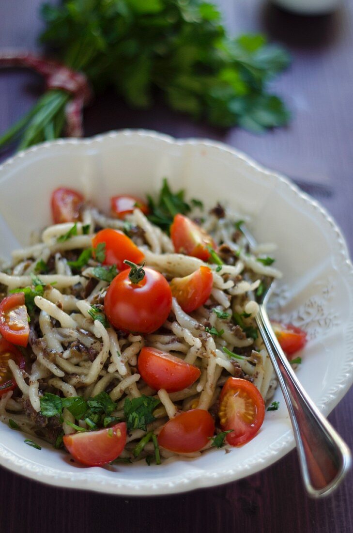 Trofie al pesto di olive nere (pasta with black with pesto, Italy)