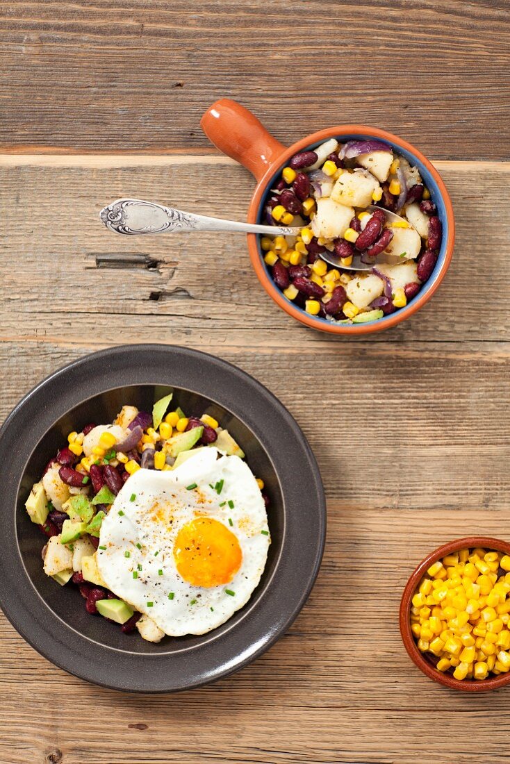 Potato salad with kidney beans, sweetcorn, avocado and fried egg
