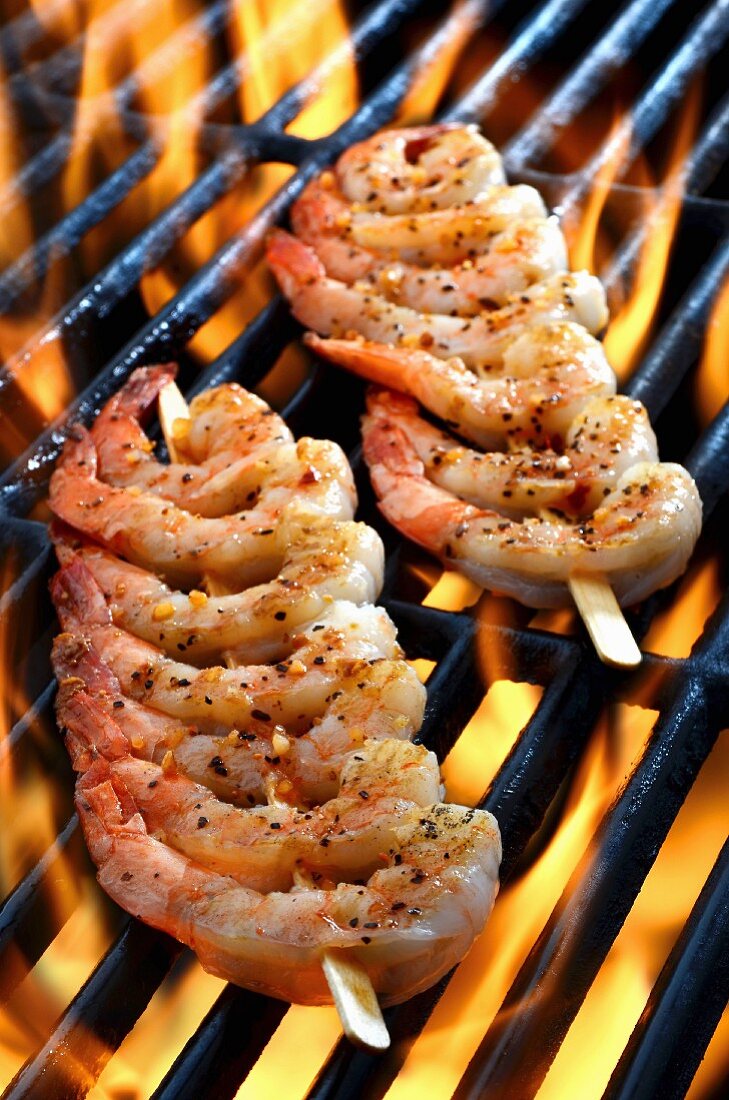 Prawn skewers on a grill (close up)