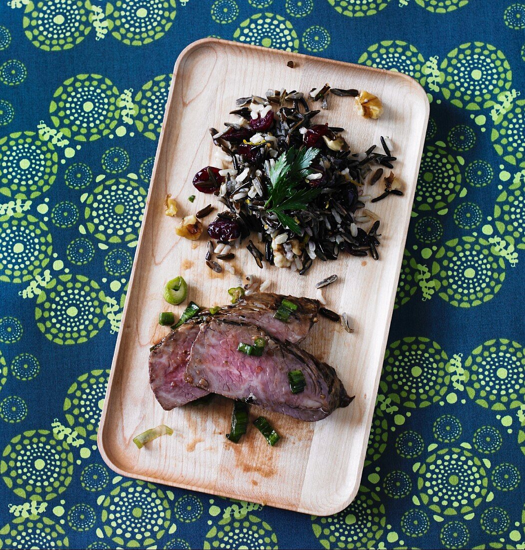 Teriyaki sirloin steak with ginger and cranberry wild rice