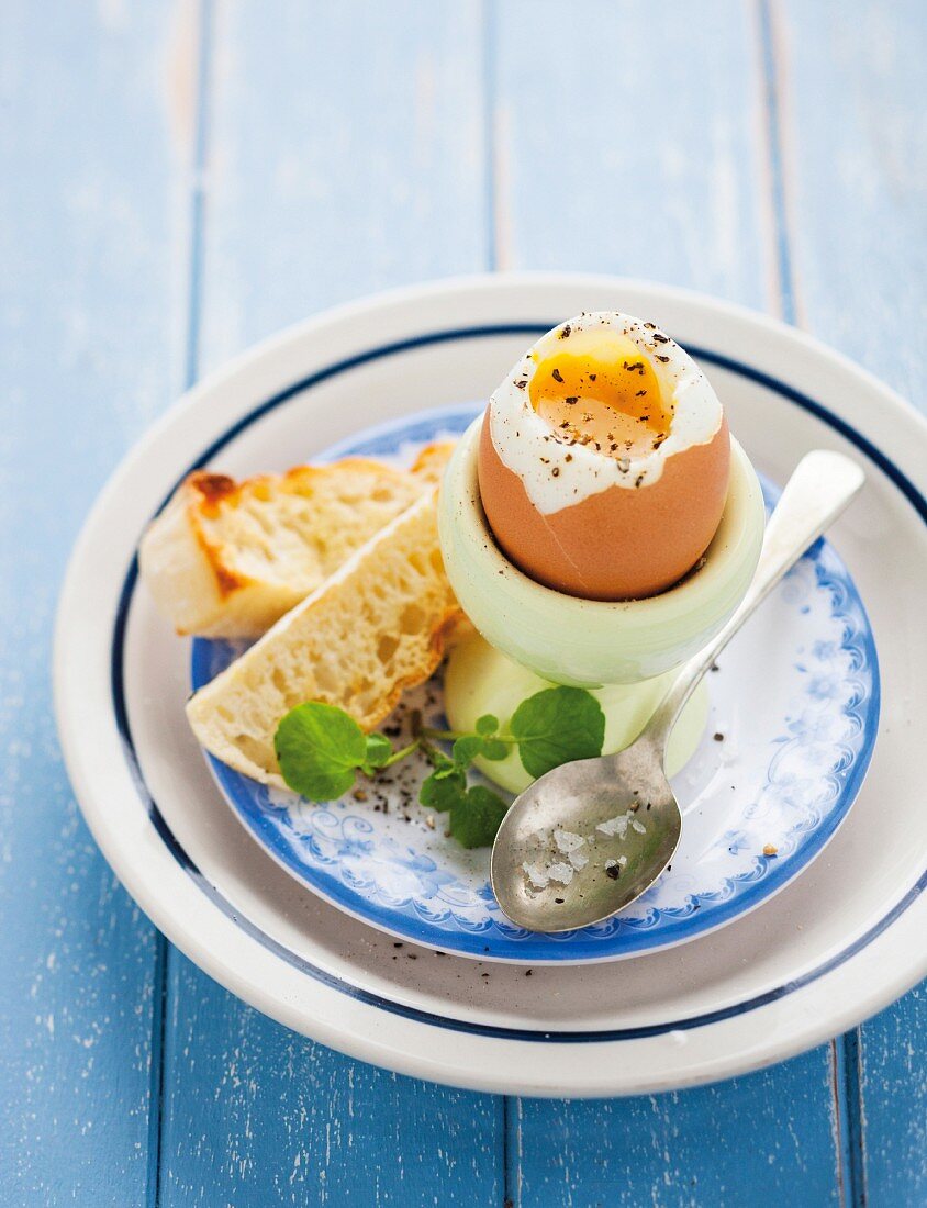 A soft-boiled egg with grilled bread