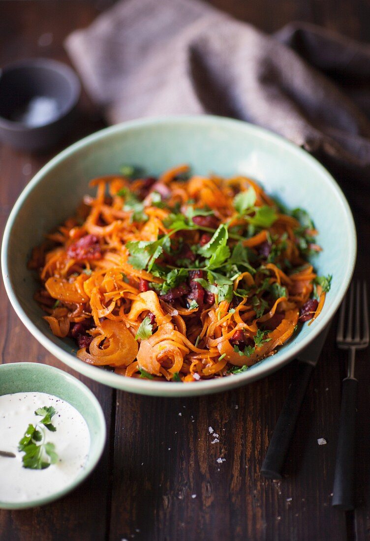 Carrot salad with sausage, coriander and a yoghurt dressing