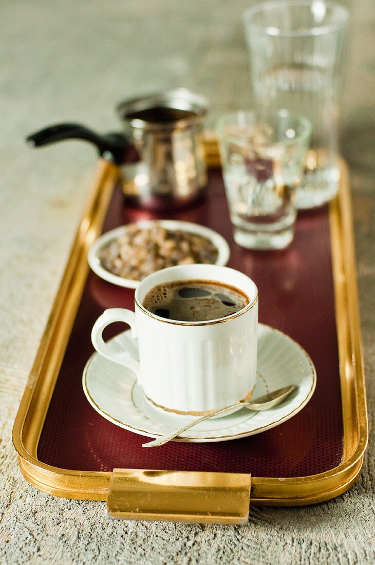 Turkish coffee and dark rock sugar on a tray