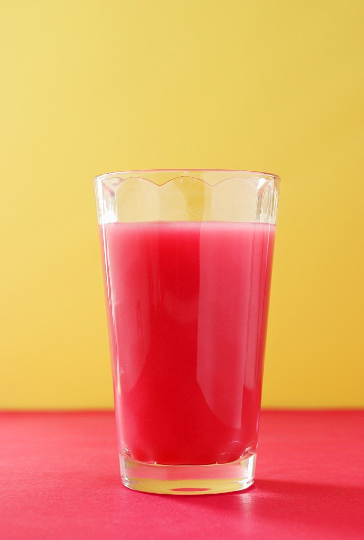 A red smoothie in a glass