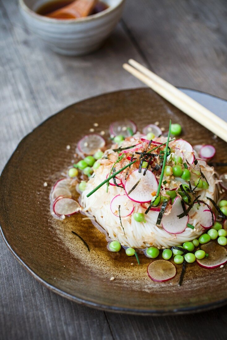 Somen noodles with peas, radish slices and seaweed (Asia)