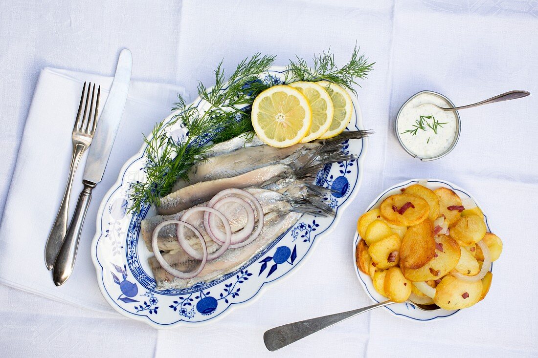 Soused herring fillets with fried potatoes and remoulade