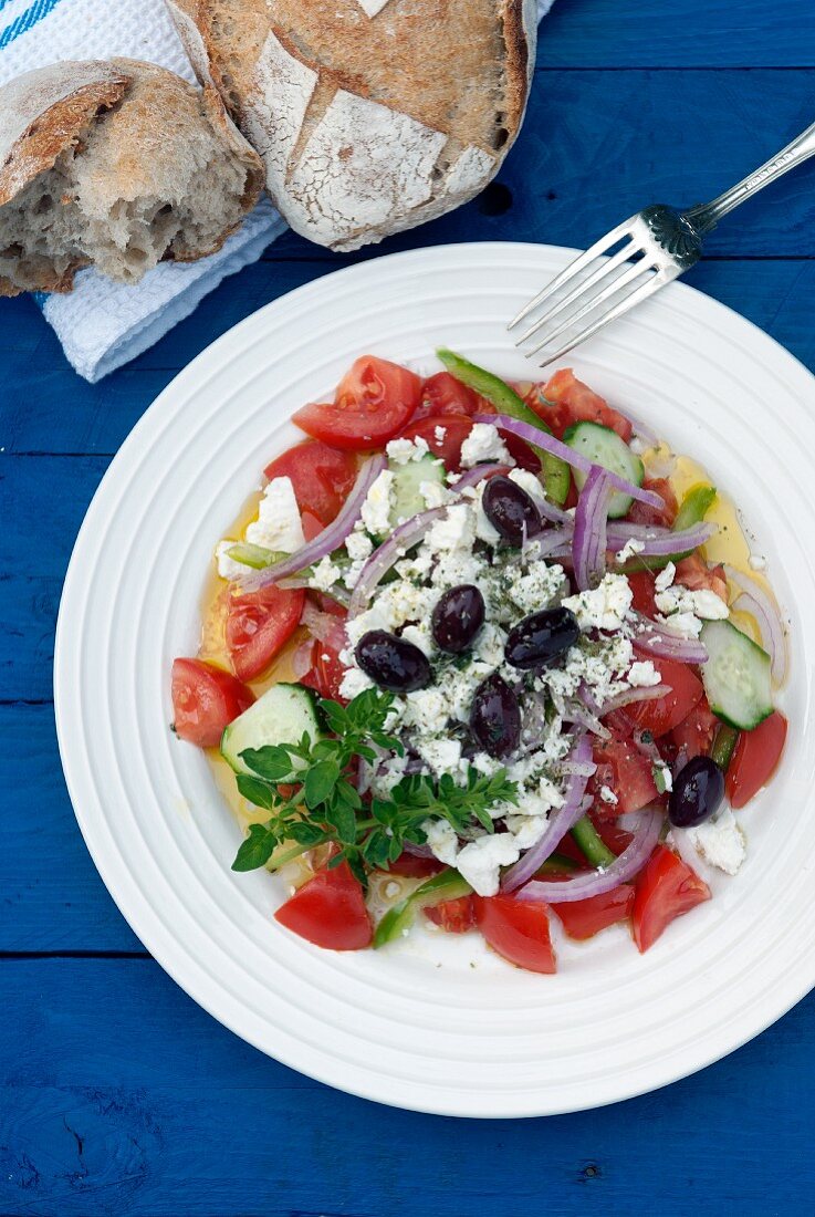 Greek salad served with crusty bread