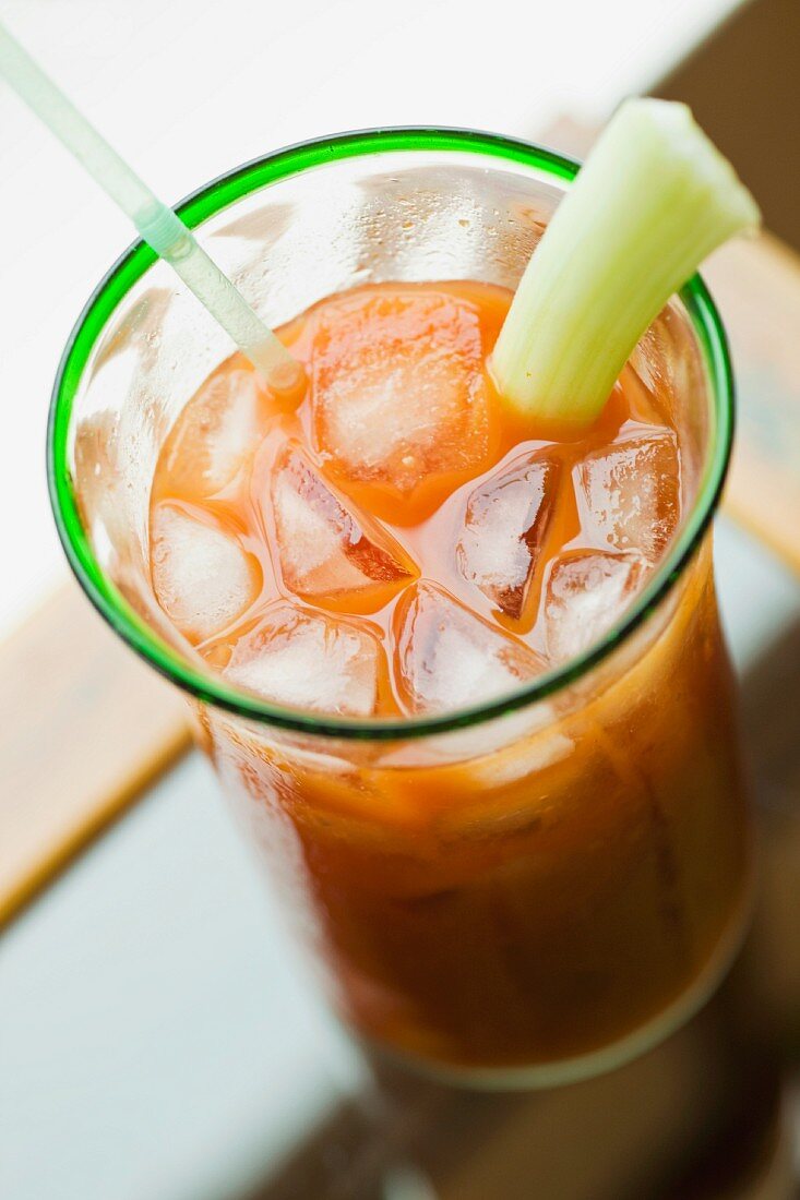 Bloody Mary with celery and ice cubes
