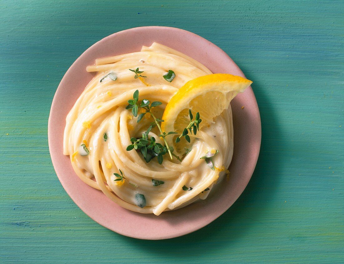 Spaghetti with a creamy lemon sauce and thyme