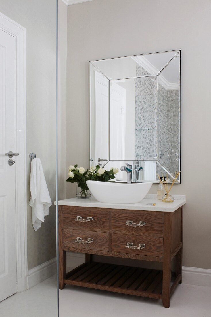 Washstand with countertop basin below mirror