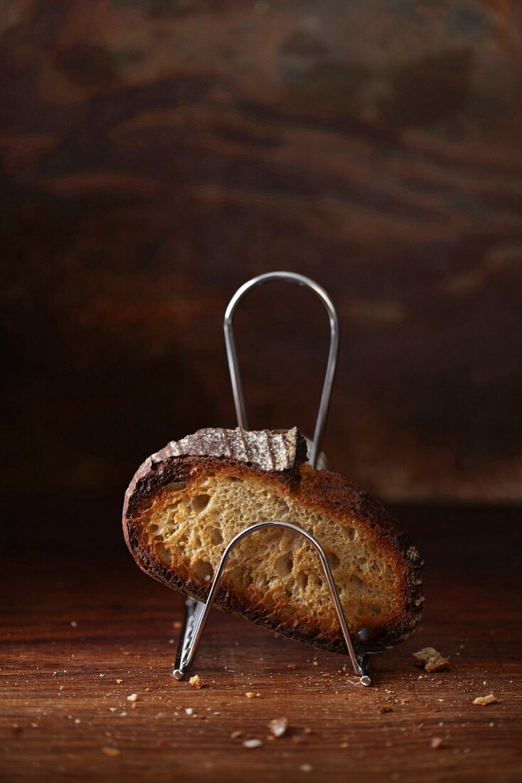 A slice of toast in a toast rack