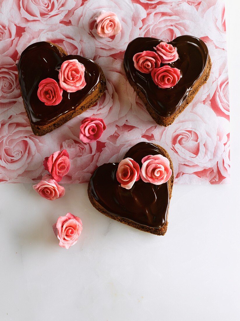 Heart-shaped chocolate cakes decorated with marzipan roses