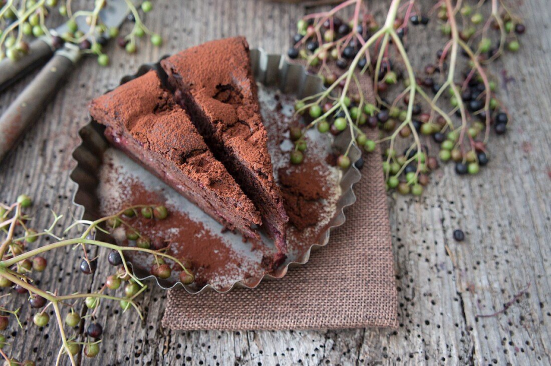 Chocolate cake with cherries and elderberries