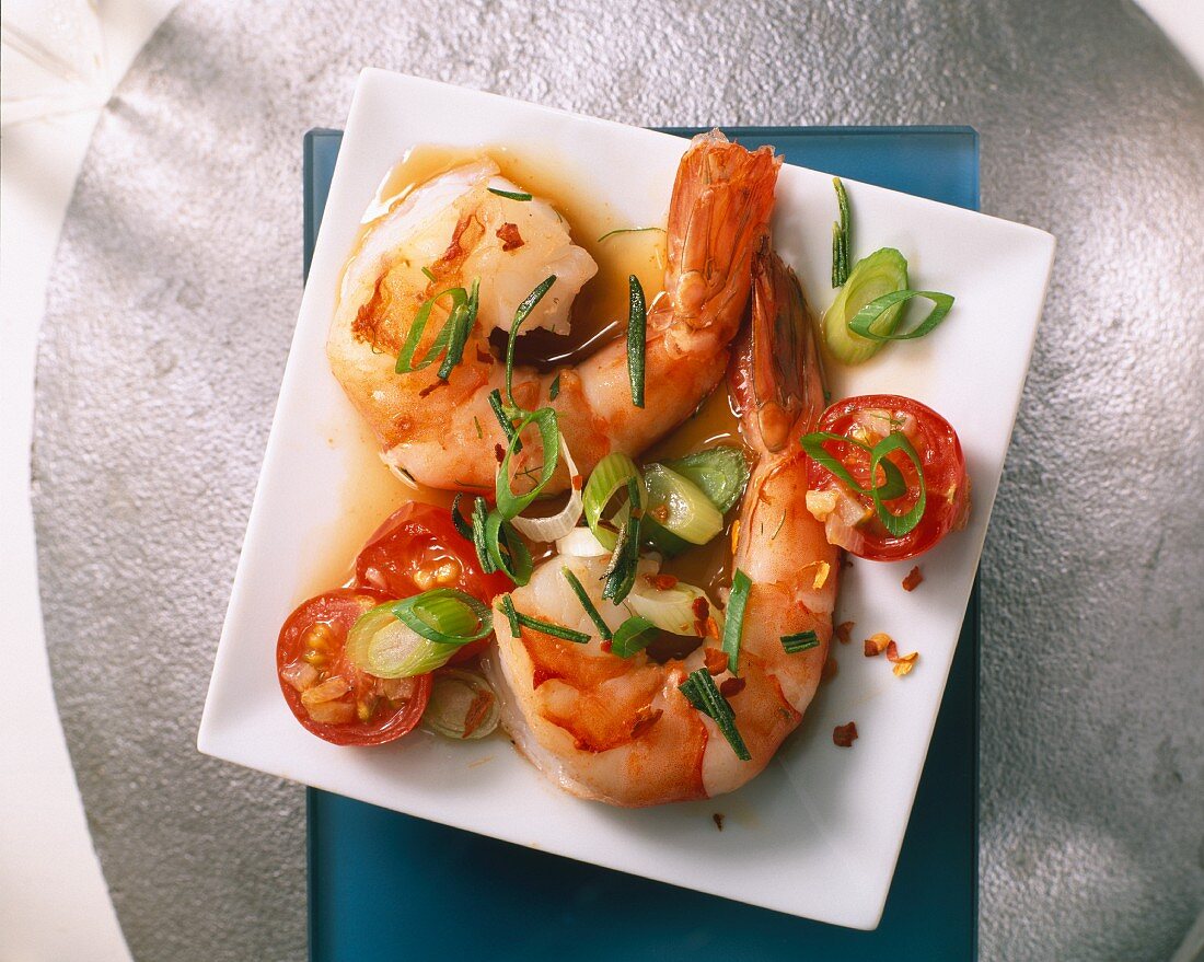 King prawns with tomatoes, spring onions, chilli and lemon balm